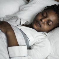 Woman lying in a bed, sleeping